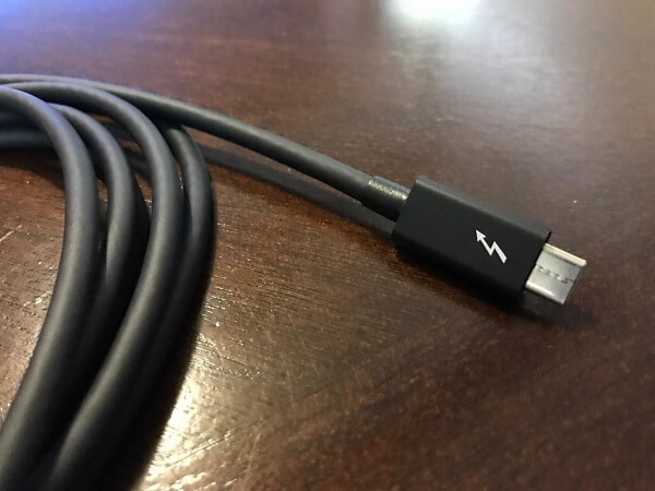 A close-up of a thunderbolt cable set on a table