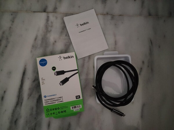 Unpacked thunderbolt cable on a table next to the box