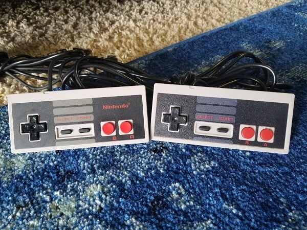 Original controller and a copy next to each other, looking almost identical 