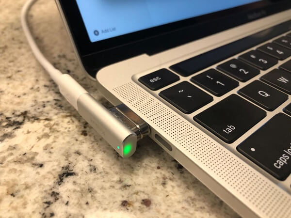 The adapter plugged into a MacBook