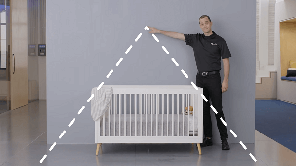 A man showing the perfect spot he found for the baby monitor