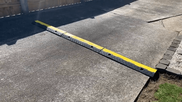 An outside cable protector on a driveway